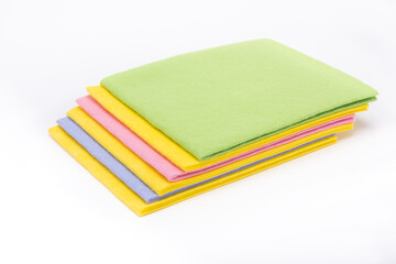 Multicolored cleaning napkins on white background