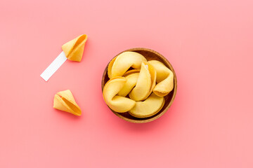 Many Chinese New Year fortune cookies in bowl. Asian New Year background