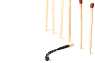 Burnt matches on a white background. The concept of burnout syndrome at work. Copy space.