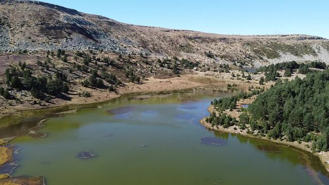 aerial footage of a mountain lake in Neila, Burgos (Spain)