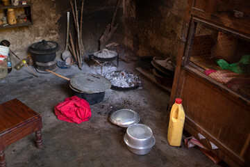 The kitchen inside a hut. African kitchen interior with hearth and stove. Interior of the modest...