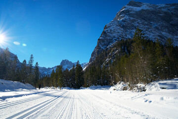 cross-country trail in a snowy austrian mountain landscape