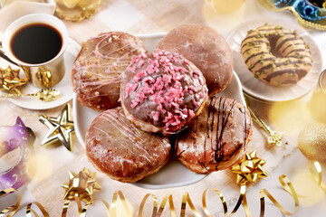 Traditional Polish doughnuts with icing and sprinkles top view