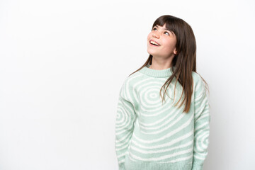 Little caucasian girl isolated on white background thinking an idea while looking up