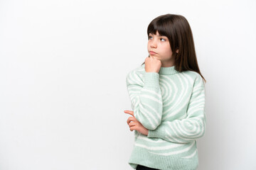 Obraz premium Little caucasian girl isolated on white background with tired and bored expression