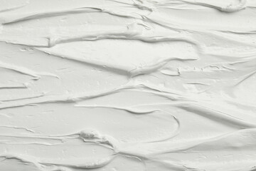 Fototapeta na wymiar Texture of white oil paint as background, closeup