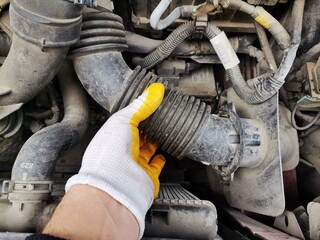 Repairing car engine.