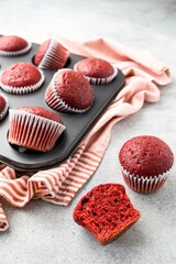 Red velvet muffins on a white background. Handmade cupcakes. Valentine day present. Selective focus.