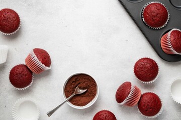 Red velvet muffins on a white background. Handmade cupcakes. Valentine day present. Top view, copy...