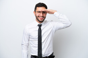 Business Brazilian man isolated on white background looking far away with hand to look something