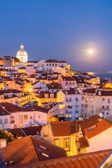 Fototapeta premium View of the typical Alfama neighborhood in Lisbon, Portugal - dome of the national pantheon.