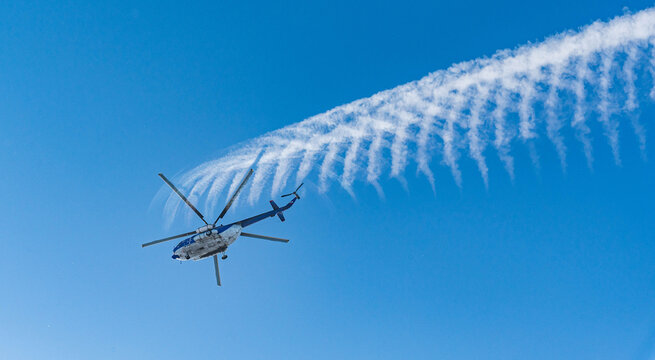 helicopter flight with a trace in the afternoon