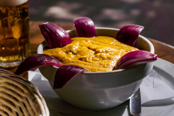 Traditional food from Gran Canaria called Gofio Escaldado is to be eaten with raw red onion.