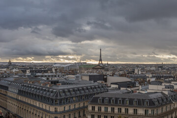 Paris rooftops with Eiffel tower in distance