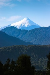 Fototapeta premium View of the Osorno volcano behind the mountains