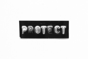 Black color banner that have embossed letter with word protect on white paper background