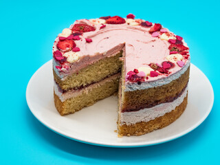 Valentine's day cake with sliced strawberry, blue background