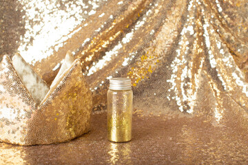 golden glitter crown on golden background