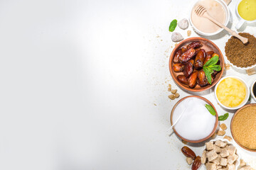 Various healthy diet replacement for sugar, natural organic sweetener concept, anti diabetes non-glycemic,  sweetener. Various fruit sugar, molasses, stevia, dates, coconut and date sugar, maple syrup