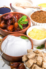 Various healthy diet replacement for sugar, natural organic sweetener concept, anti diabetes non-glycemic,  sweetener. Various fruit sugar, molasses, stevia, dates, coconut and date sugar, maple syrup