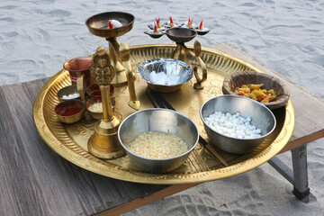 Paraphernalia for puja and arati on the banks of the Ganges. Items for ritual worship in Hinduism.