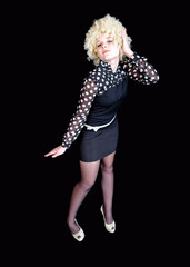 Curly girl - blonde in funny clothes like a clown on a black background