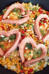 fried eggs with sausages hearts
