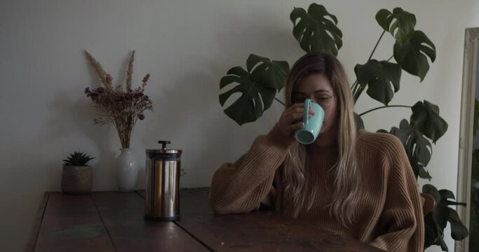 Girl drinks her coffee in the morning
