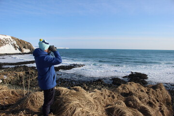man looking at the sea