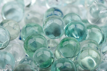 Macro shot of glass marbles with the back of the frame blurred.