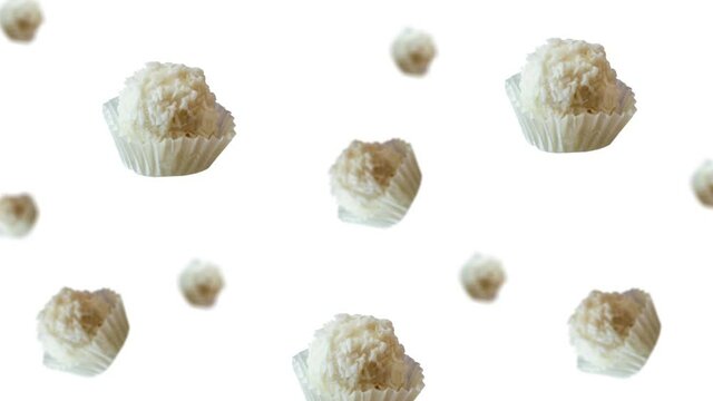 Animated Round Coconut tasty dessert Raffaello candy of different diameters flying and wiggle in the air  on isolated background. Valentines day, Date, Wedding, 8 March, Womens gift. Romantic love con