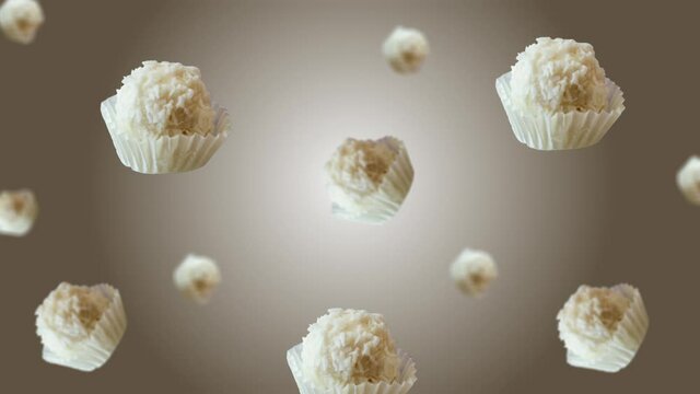 Collection of many different diameters Raffaello is a spherical coconut almond confection, flying and wiggle on the white gradient backgroun. traditional Valentine's, Date day sweets gift concept. 4k 