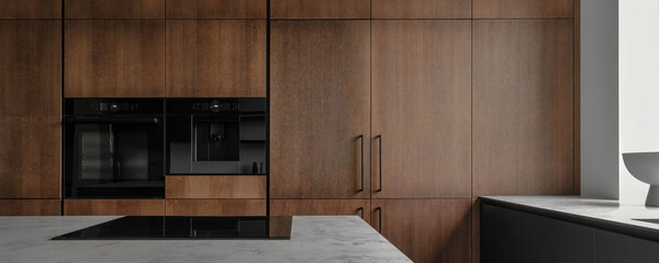 Modern minimalistic kitchen with black and wooden surfaces, marble kitchen island top and household...