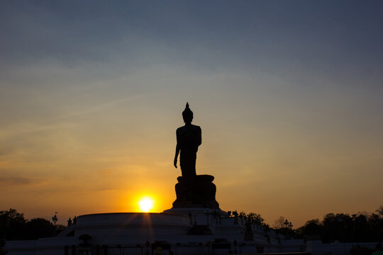 blurry images Beautiful Buddha statue in the evening sunset, Thailand