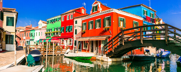 Fototapeta na wymiar Most colorful places (towns) - Burano island, village with vivid houses near Venice, Italy travel and landmarks