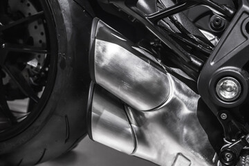 Sports motorcycle engine fragment with exhaust pipes
