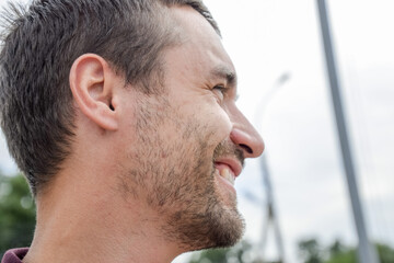 Face profile of a bearded man. unshaven face Beard on the face of a young man.