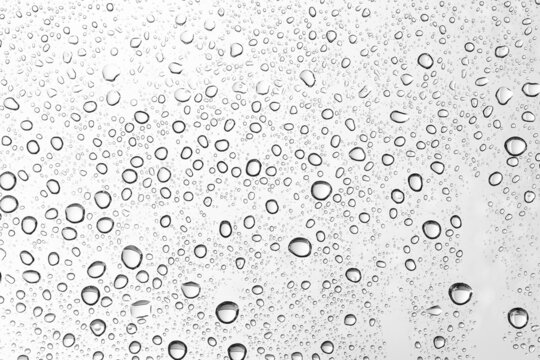 Water drops on car glass. Rain drops on the clear window.