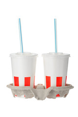 two plastic cups with drinking tubes on a cardboard stand on a white insulated background