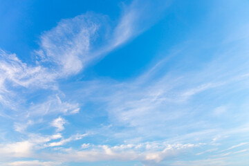 Naklejka na ściany i meble Blue sky with small white clouds for background usage.