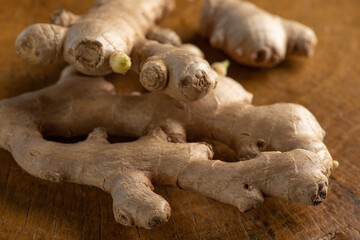 Ginger, commonly used ginger root in Brazil on rustic wood, selective focus.