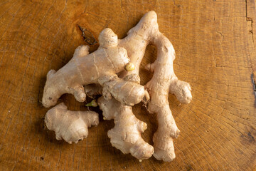 Ginger, commonly used ginger root in Brazil on rustic wood, top view.