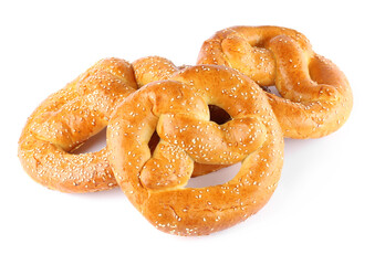 Tasty freshly baked pretzels on white background