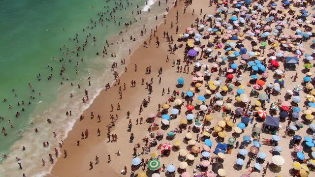 Rio de Janeiro, Brazil, aerial establishing shot showing famous Copacabana Beach during summer.