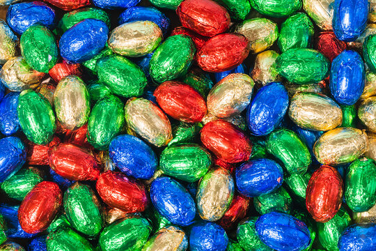 Over Head Shot Of Colourful Chocolate Easter Eggs On Table