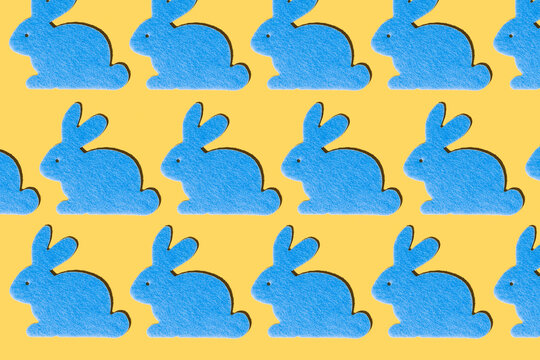 Blue rabbits pattern on a yellow background