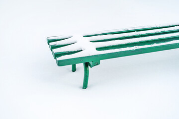 A bench covered with snow in winter, minimalism