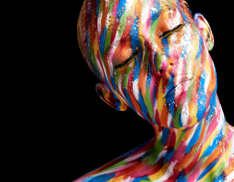 Let your imagination come to life. Cropped shot of a young woman posing with paint on her face.