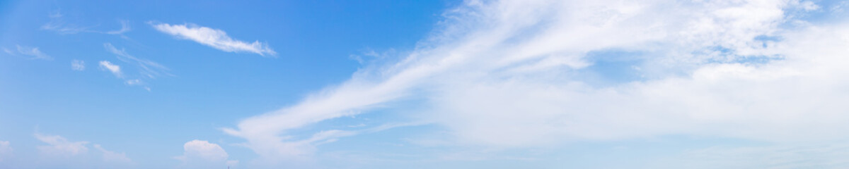 Panorama or panoramic photo of blue sky and white clouds or cloudscape.
