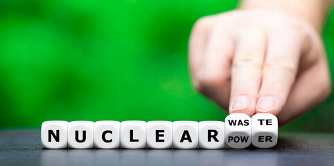 Symbol against nuclear power. Hand turns dice and changes the expression 